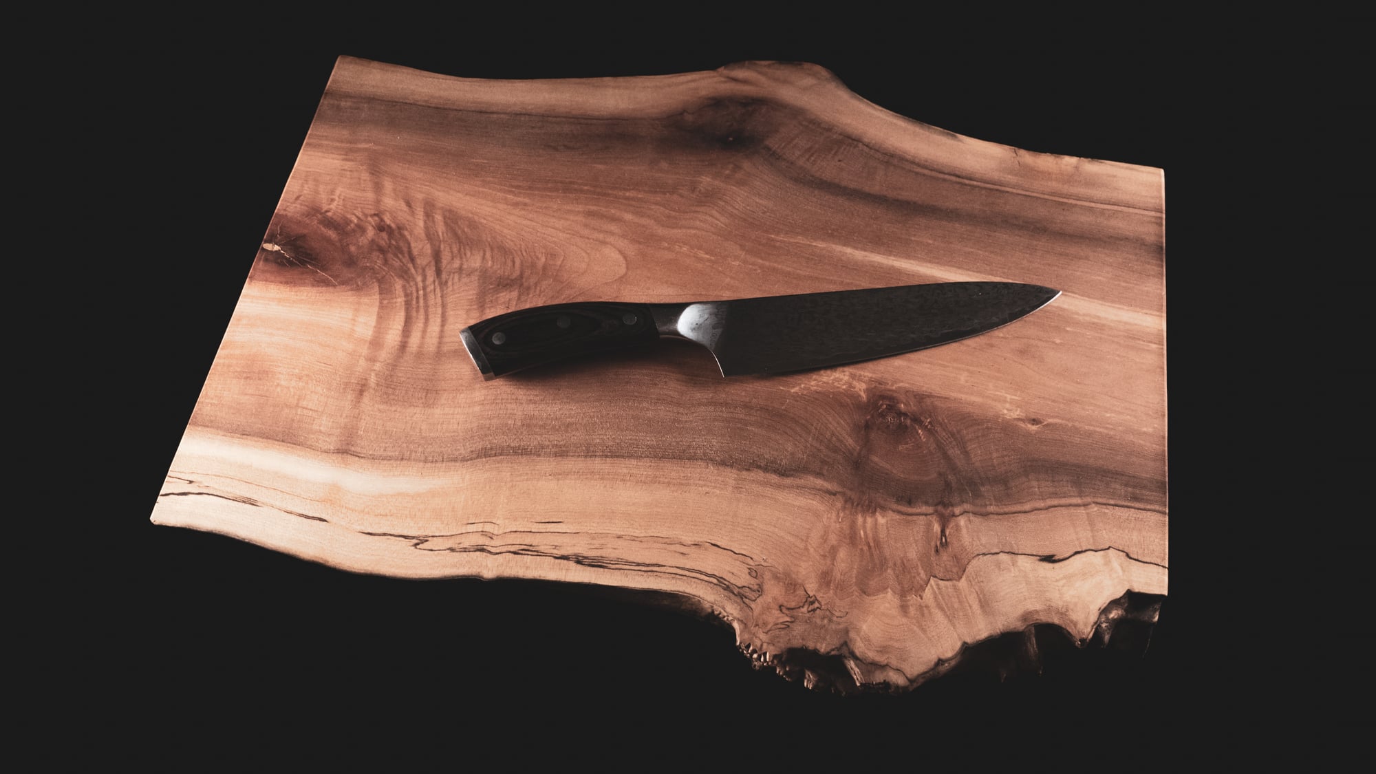 live edge board with knife overhead